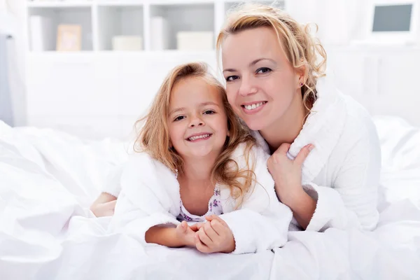 Woman and little girl after bath — Stock Photo, Image
