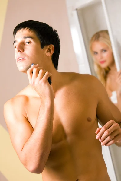 stock image Funny scene of young couple at bathroom