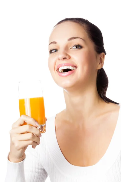 Portrait of happy smiling young woman with glass of orange juice, isolated — Stock Photo, Image