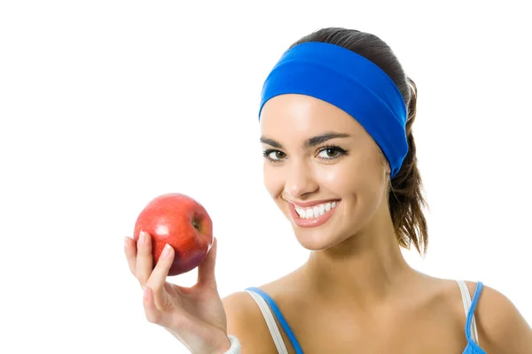 Frau im Fitnessanzug mit Apfel, isoliert — Stockfoto