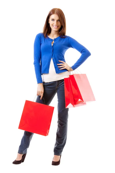 Młoda kobieta szczęśliwa z torby na zakupy, na białym tle — Zdjęcie stockowe