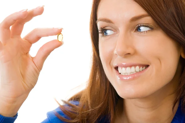 Młoda kobieta szczęśliwa z ryb omega-3 olej capsula, na białym tle — Zdjęcie stockowe