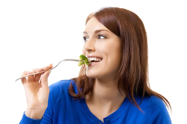 브로콜리, 흰색 절연을 먹는 젊은 행복 한 여자 — 스톡 사진
