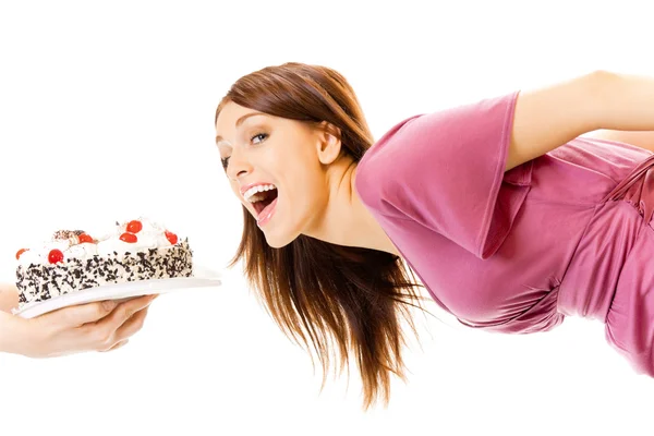 Молода голодна глуха жінка їсть пиріг, ізольована на білому — стокове фото