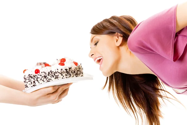 Jonge hongerige gulzig vrouw eten taart, geïsoleerd op wit — Stockfoto