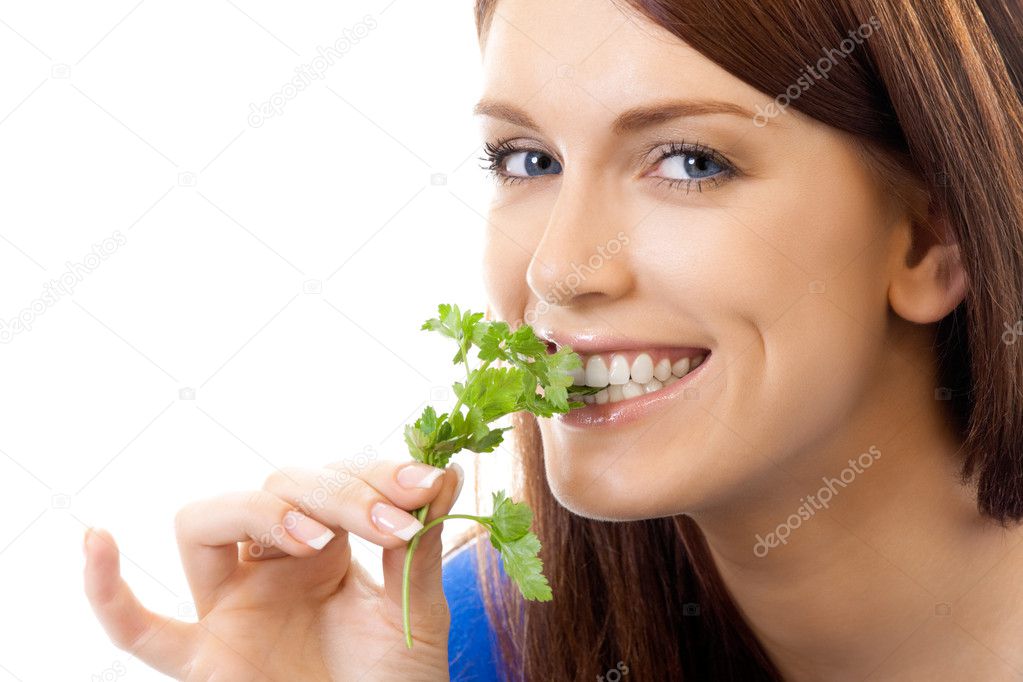 Young smiling woman with potherbs, isolated on white