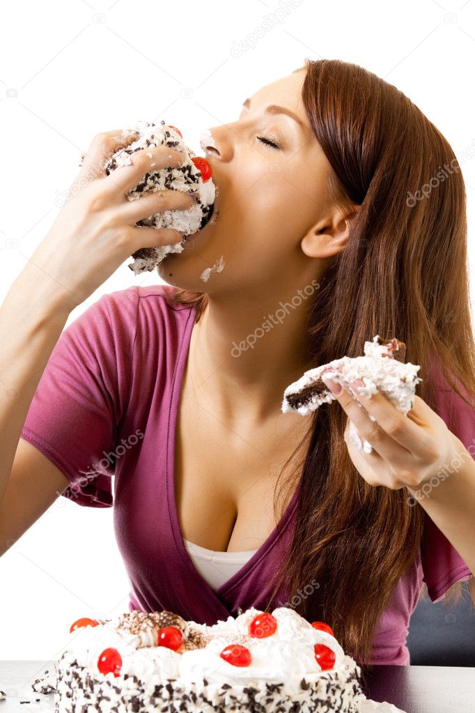 Young hungry gluttonous woman eating pie, isolated on white