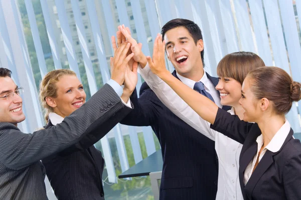 Happy successful gesturing business team at office — Stock Photo, Image