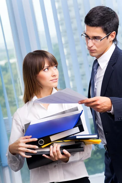 Two businesspeople working with documents at office — Stock Photo, Image