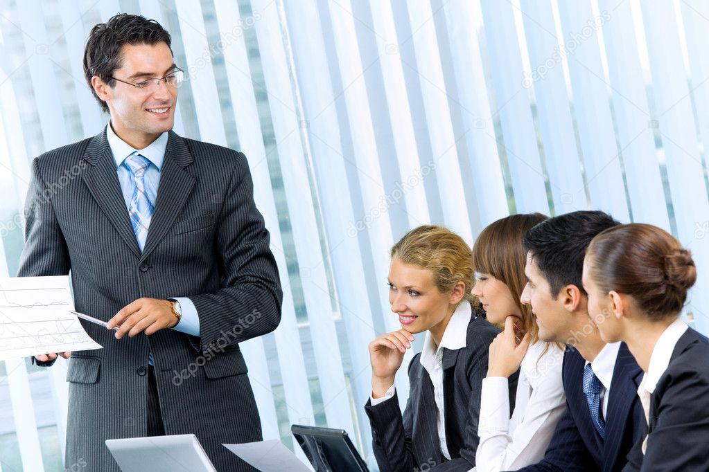 Businesspeople at business meeting, seminar or conference