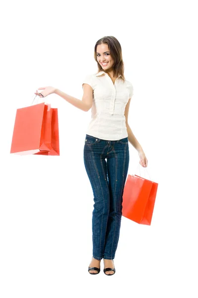 Jonge vrouw met boodschappentassen, geïsoleerd — Stockfoto