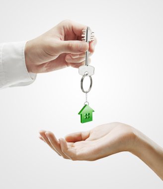 Man is handing a house key to a woman clipart