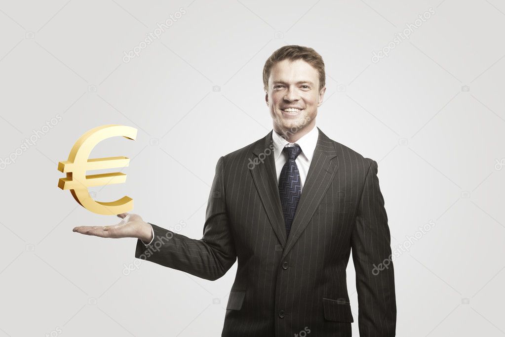 Young businessman chooses a Gold Euro Sign.
