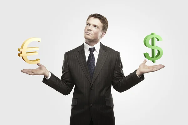 Young businessman chooses a green US dollar signs — Stock Photo, Image