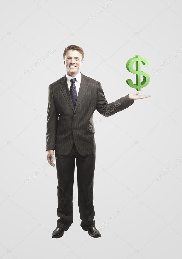 Young businessman chooses a green US dollar sign.