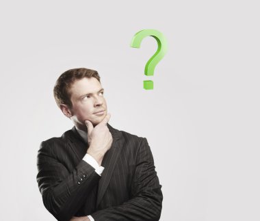 Portrait of a young man with green question mark above his head. clipart