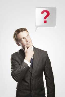 Portrait of a young man with question mark above his head. clipart