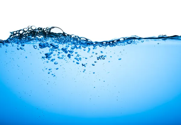 Bubbels in blauw water Stockfoto