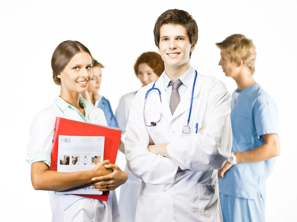 Grupp av leende medicinska på vit bakgrund — Stockfoto