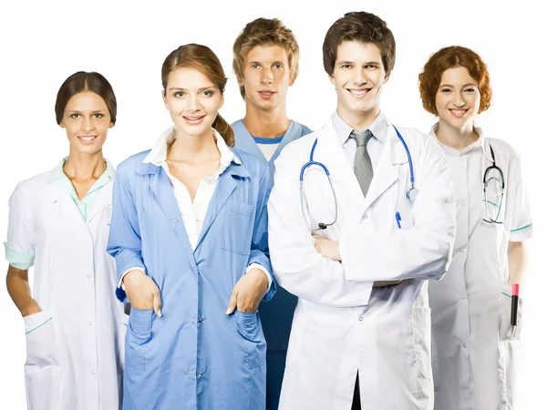 Grupo de médicos sonrientes sobre fondo blanco Imágenes de stock libres de derechos