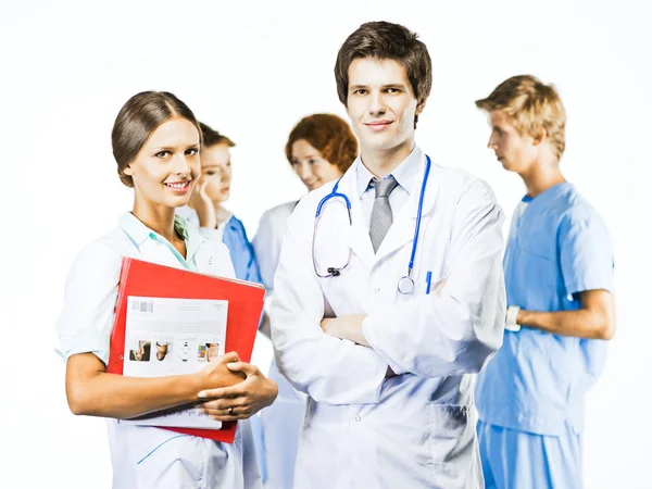 Gruppe lächelnder Mediziner auf weißem Hintergrund Stockbild