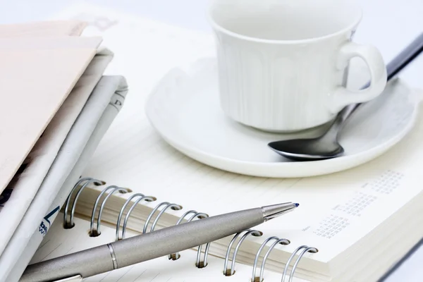Office supplies with a cup of coffee — Stock Photo, Image