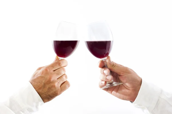 赤ワインのグラスで乾杯を手します。 — ストック写真