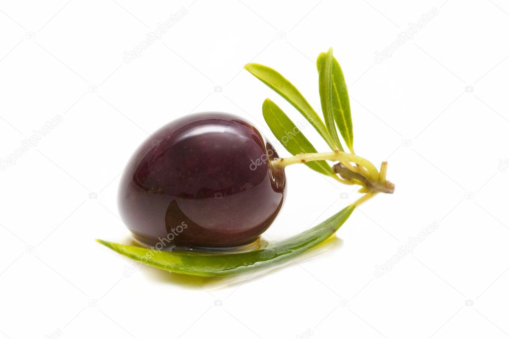 Macro of a fresh olives bathed in olive oil