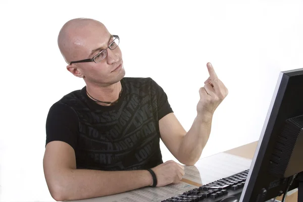 Man shows his middle finger to monitor — Stock Photo, Image