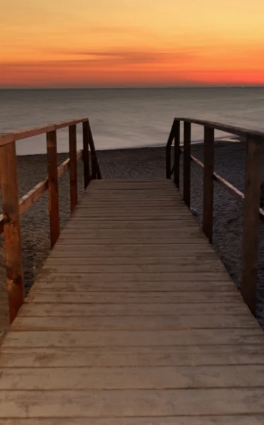 Pontile zadní il mare al tramonto — Stock fotografie