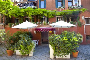 Hotel entrance with green plants