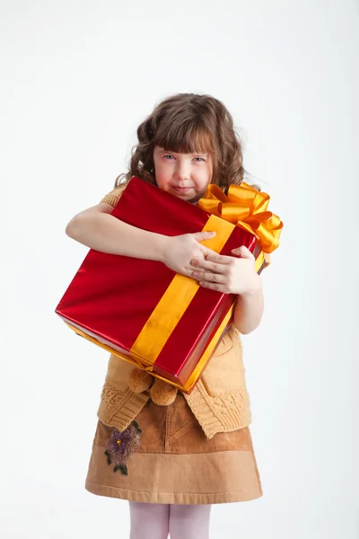 Greedy girl with a gift — Stock Photo, Image