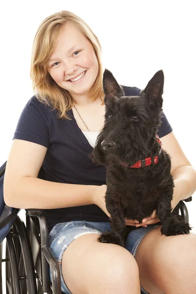 Девушка-инвалид со Скотти Догом — стоковое фото
