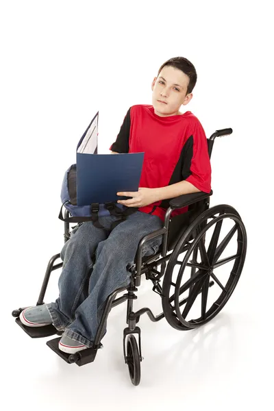 坐在轮椅上的少年小学生 — 图库照片