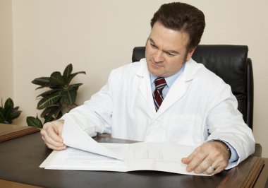 Doctor at his Desk clipart