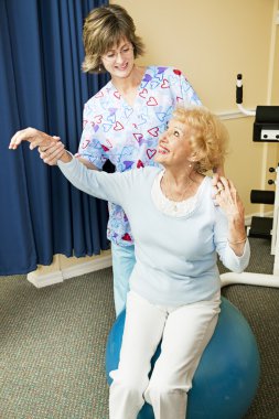 Physical Therapist Helps Senior Woman clipart