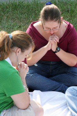 Two Prayerful Teens clipart