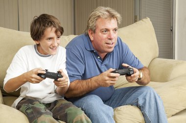 Man and Boy Play Video Games clipart