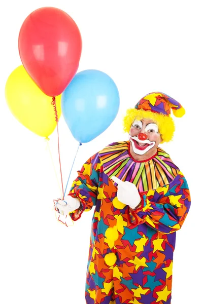 Clown zeigt auf Luftballons — Stockfoto