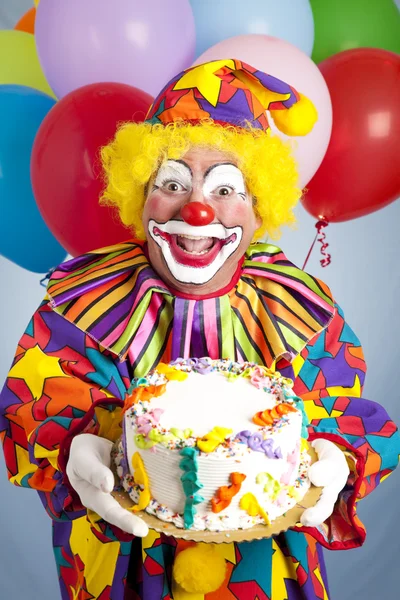 Palhaço louco com bolo de aniversário — Fotografia de Stock