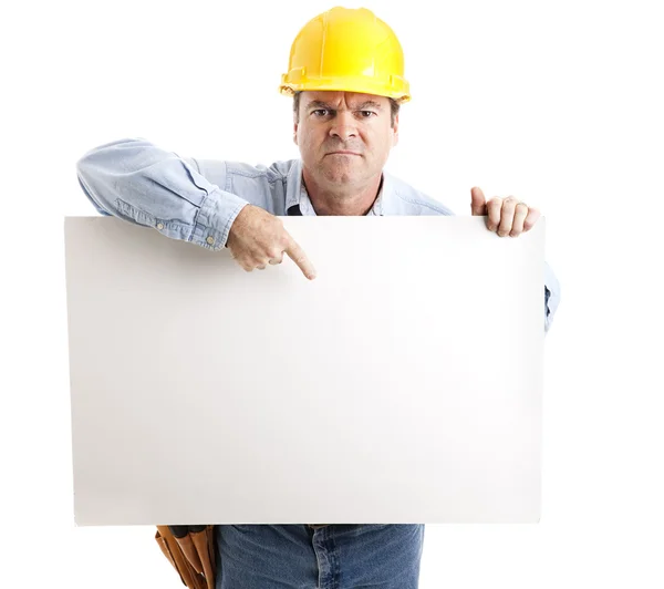 Trabalhador irritado com sinal — Fotografia de Stock