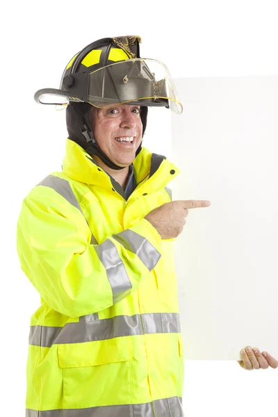 Entuzjastycznie strażak z znak — Zdjęcie stockowe