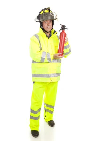 Пожарный с огнетушителем — стоковое фото