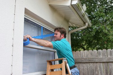 Homeowner Tapes Windows clipart