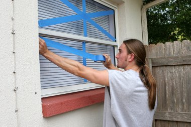 Teen Taping Windows H clipart