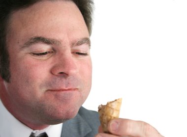 Businessman Savoring Ice Cream clipart