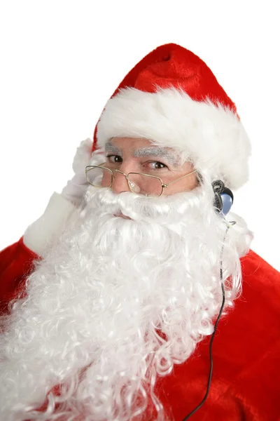 Weihnachtsmann hört Kopfhörer — Stockfoto