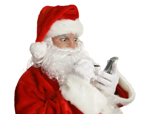 Weihnachtsmann frech liste auf pda — Stockfoto