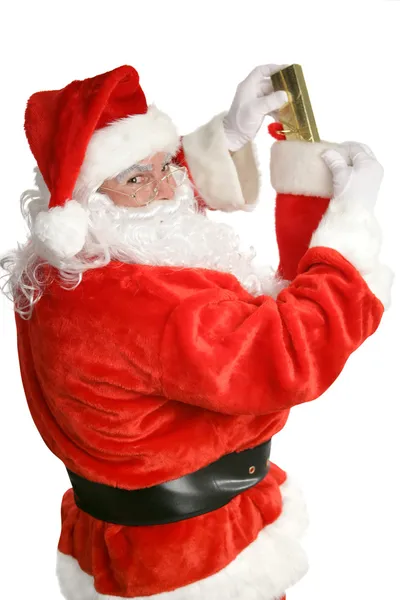Santa Stuffing Stockings — Stock Photo, Image