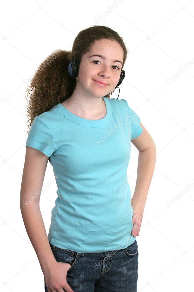 A smiling teen girl in a blank blue t-shirt and listening to headphones. Tee shirt ready for logo.